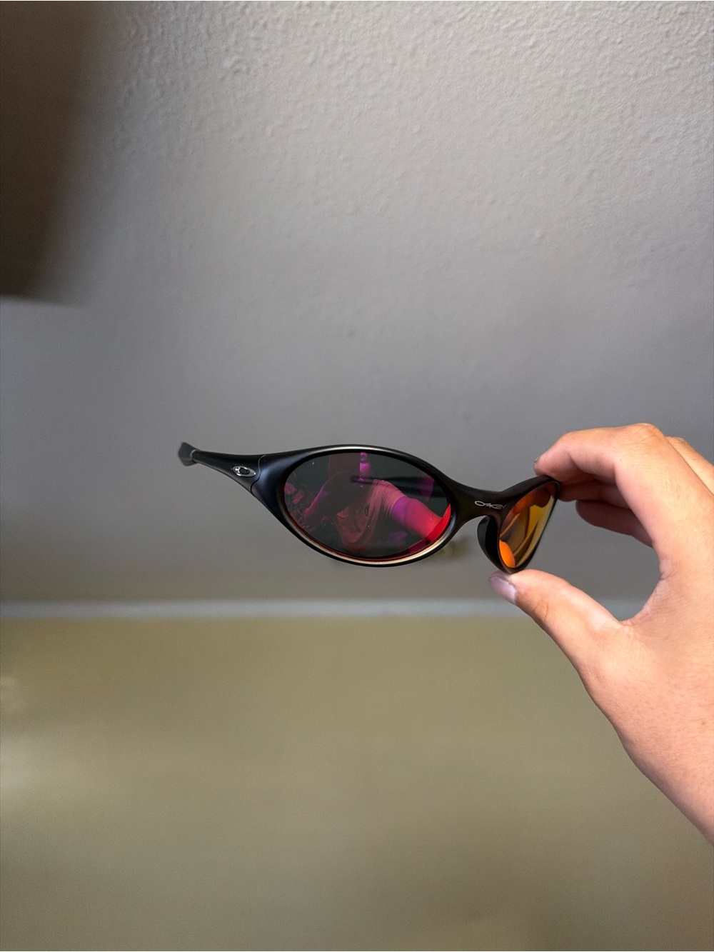 Black Sunglasses with Red-Orange Mirrored Lenses Oakley